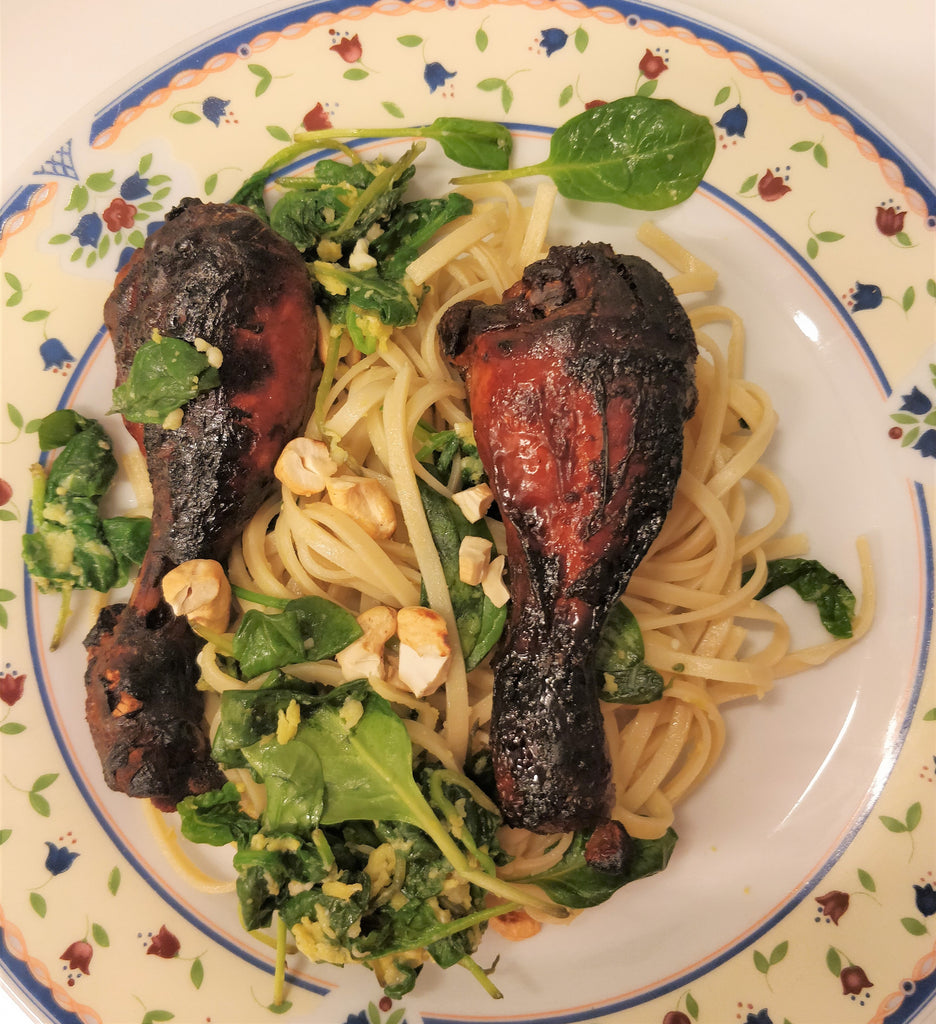 Slow cooker BBQ drumsticks served with garlic spinach noodles