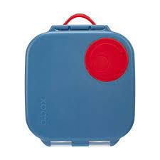b.box Mini Lunchbox blue blaze. Blue lid, round silicone circle on the top right corner. This stretches around the fruit, helping eliminate bruised and uneaten snacks.